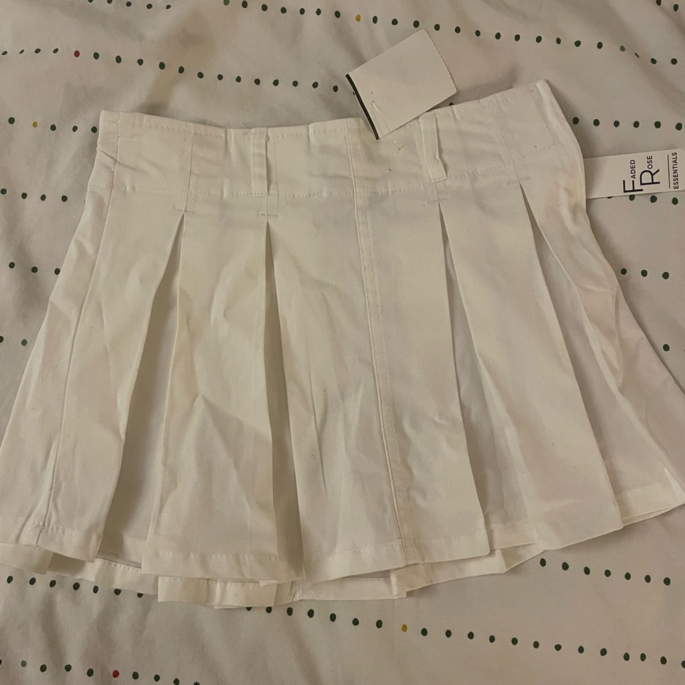 white pleated mini skirt